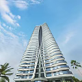 Modern High Rise Apartment Building Architecture With Blue Sky White Clouds And Palm Trees
