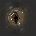Transparent Glass Light Bulb with Filament and Screw Base on Dark Background