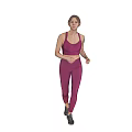 Woman In Pink Sports Bra And Leggings Running Against Gray Background