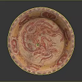 Traditional Carved Circular Plate with Red Dragon Pattern and Decorative Border