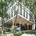 Modern Detached Villa With Glass Facade Surrounded by Lush Trees and Greenery