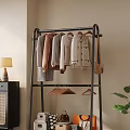 Modern Interior Floor Standing Clothes Rack With Hanging Sweaters And Small Hangers