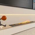 Modern Linear Fireplace with Burning Flames Large TV and Orange Balloon Figure on Light Countertop