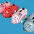 Cute Pig Shaped Toys In Various Colors And Patterns On Blue Background