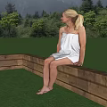 Woman In White Wrap Dress Sitting On Wooden Platform With Green Meadow Trees And Mountains