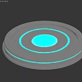 Gray Circular Electronic Device With Blue Central Panel And Light Rings