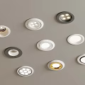 Various Styles Recessed Lights In Different Colors On Gray Wall Background