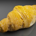 Golden Freshly Baked Croissant With Flaky Texture Crispy Crust And Buttery Taste