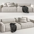 Light Colored Two Seater Sofa With Cushions And Dark Blanket In Living Room Interior