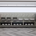 Modern Reception Area with Marble Wall Red Brick Background Grey Devices White Containers Herringbone Floor