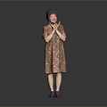 Woman Standing In Floral Dress With Clasped Hands And Purple Shoes On Gray Background