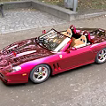 Shiny Red Convertible Sports Car With Open Top Glossy Finish And Sleek Design