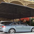 Carport Covering Two Cars With Stone Wall Arched Structure And Greenery Background