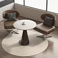 Stylish Round Table With Brown Chairs On Woven Rug In Modern Room With Wooden Floor