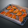 Golden Brown Baked Dumplings Arranged On Parchment Lined Baking Tray