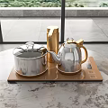 Modern Household Electrical Appliances With Silver Teapot Covered Pot Golden Thermos On Brown Heating Plate