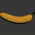 Ripe Yellow Speckled Banana With Green Stem On Dark Reflective Background