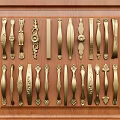 Collection of Golden Handles With Different Designs Displayed On Wooden Background
