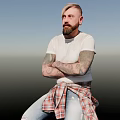 Bearded Man In White T-Shirt With Tattooed Arms Sitting On Bar Stool Against Gradient Background