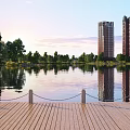 Tranquil Scenic View of Calm Lake With Wooden Dock Trees and Tall Building Reflections