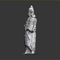 Man Statue Standing In Traditional Attire Holding Sword With Detailed Carving