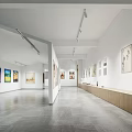 Spacious Art Book Gallery Interior With Wall Displayed Paintings Track Lighting And Wooden Counters