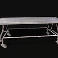 Sturdy Metal Medical Cart With Four Wheels And Flat Surface For Hospital Use