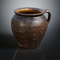 Handmade Traditional Clay Pot with Crackled Texture and Curved Handle on Dark Reflective Surface