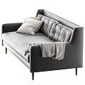 Gray Leather Sofa with Tufted Backrest Patterned Pillows Throw Blanket and Wooden Legs