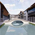 Modern Commercial Street With Water Canal Buildings Shops Outdoor Seating And Greenery Reflections