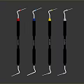 Dental Probes With Colorful Tips And Black Handles On Gray Background