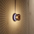 Elegant Modern Wall Lamp on Wooden Wall with Radiant Warm Light Effect