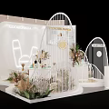 Modern Liquor Store Exhibition Booth With White Arched Structures Green Plants And Displayed Bottles