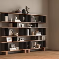 Modern Wooden Bookcase with Multiple Shelves Holding Books Decorative Sculptures Vases and Photo Frames
