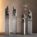 Traditional Stone Pillars With Carved Figures And Intricate Ornate Details