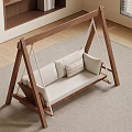 Indoor Wooden Swing Leisure Chair with Light Colored Cushion and Decorative Pillows on Soft Rug