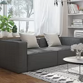Modern Living Room With Gray Sofa White Cushions Coffee Table Geometric Rug And Green Plants