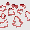 Red Cookie Cutters With Various Shapes Including Star Christmas Tree And Heart