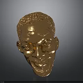 Golden Human Head Sculpture Showcasing Detailed Facial Features And Shiny Surface