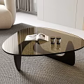 Modern Glass Coffee Table With Black Base Open Book And Small Cups On Gray Carpet