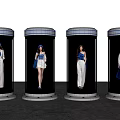 Women in Transparent Cylindrical Containers Wearing Blue and White Outfits Hats Shoes and Handbags