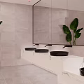 Modern Public Restroom With Marble Countertops Black Sinks Large Mirrors And Green Plants