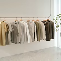 Hanging Casual Shirts And T-Shirts With Neutral Tones On Minimalist White Wall
