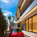 Modern Detached Villa With Wooden Windows Rooftop Greenery Pathway And Red Car