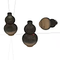 Three Gourd Shaped Ceramic Vases With Brown Black Hues And Red Accents