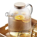 Elegant Tableware Set with Wooden Tray Glass Pitcher Lemon Slices White Cups Cookies Dried Grass