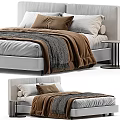 Modern Bedroom Bed With White And Brown Pillows Gray Knit Blanket And Round Side Table