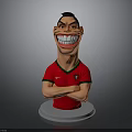 Cartoon Football Player Figurine in Red Jersey with Portugal Logo Arms Crossed on White Base