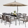Stylish Black Metal Outdoor Patio Table With Wicker Chairs And Beige Umbrella