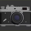 Vintage Analog Camera With Silver Black Body And Blue Lens Design